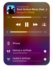 Apple Music interface on iPhone that shows two pairs of AirPods listening to the same song from one device, both sets of AirPods have individual volume settings.