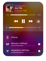 Apple Music interface on iPhone that shows two pairs of AirPods listening to the same song from one device, both sets of AirPods have individual volume settings.