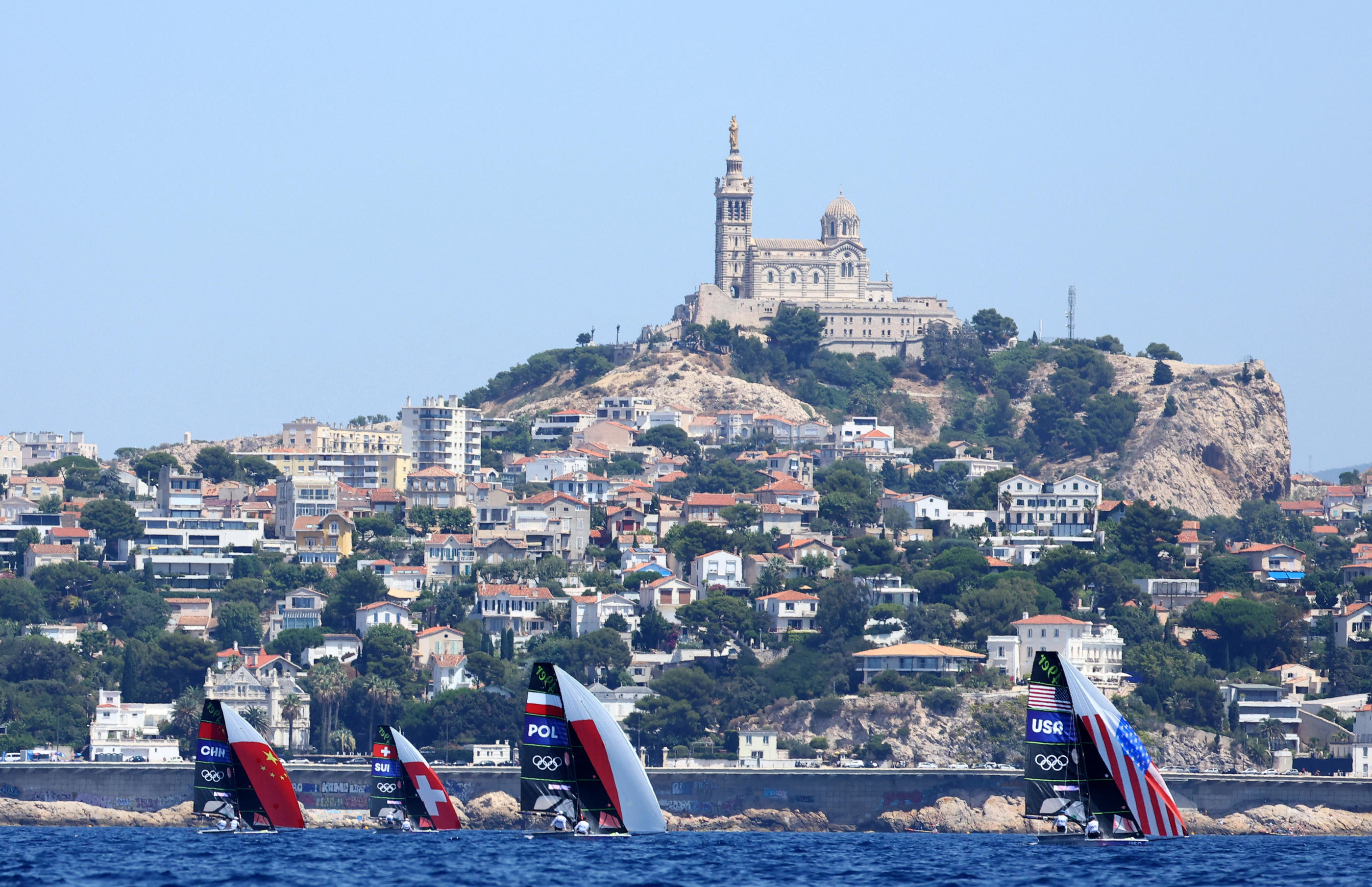 Les épreuves de voile des JO se déroulent à Marseille. Une manne pour les commerçants proche de la Marina ? REUTERS/Andrew Boyers