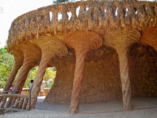 Antonio Gaudí Park Güell - large organic looking columns made from stone.