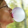 Woman blowing bubble gum