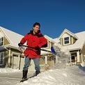 man shoveling snow from driveway