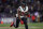 BALTIMORE, MARYLAND - JANUARY 20: Running back Devin Singletary #26 of the Houston Texans rushes against the Baltimore Ravens in the AFC Divisional Playoff game at M&T Bank Stadium on January 20, 2024 in Baltimore, Maryland. (Photo by Patrick Smith/Getty Images)