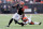 CINCINNATI, OHIO - JANUARY 07: Ja'Marr Chase #1 of the Cincinnati Bengals runs with the ball while defended by Vincent Gray #31of the Cleveland Browns at Paycor Stadium on January 07, 2024 in Cincinnati, Ohio. (Photo by Andy Lyons/Getty Images)