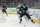 SEATTLE, WASHINGTON - APRIL 11: Eeli Tolvanen #20 of the Seattle Kraken skates the puck away from Jan Rutta #84 of the San Jose Sharks during the third period of a game at Climate Pledge Arena on April 11, 2024 in Seattle, Washington. (Photo by Christopher Mast/NHLI via Getty Images)