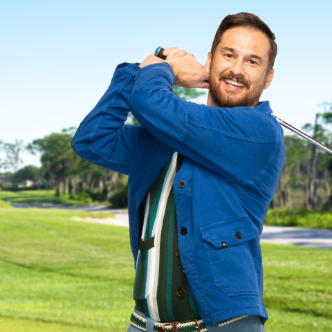 Man in blue jacket with golf club 3840x1380.jpg