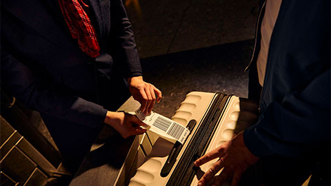 A customer being checked-in by BA staff.