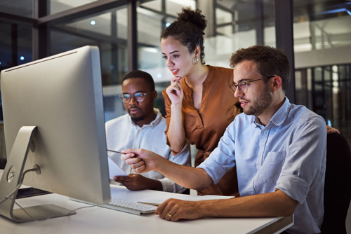 Women training two coworkers