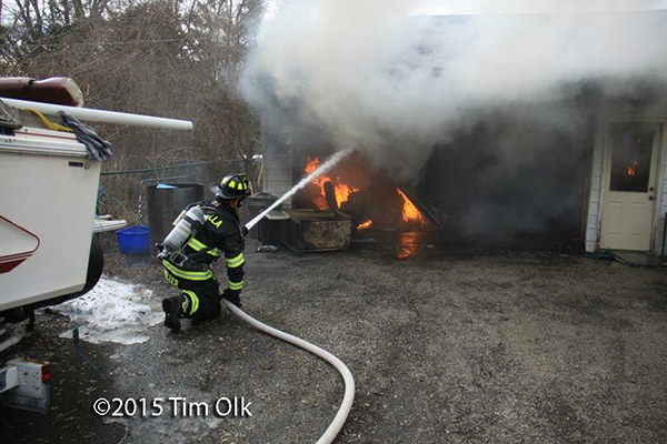 fireman fights garage fire