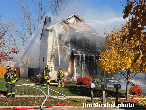 Firefighters use foam on house fire