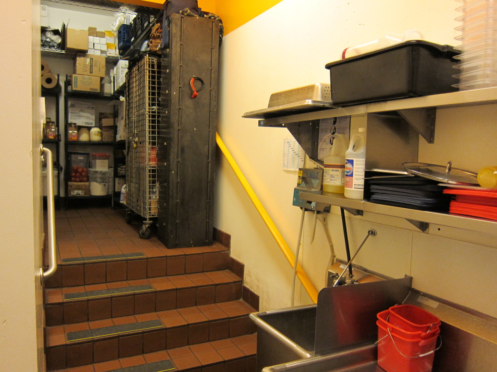 Continue through the restaurant's supply closet