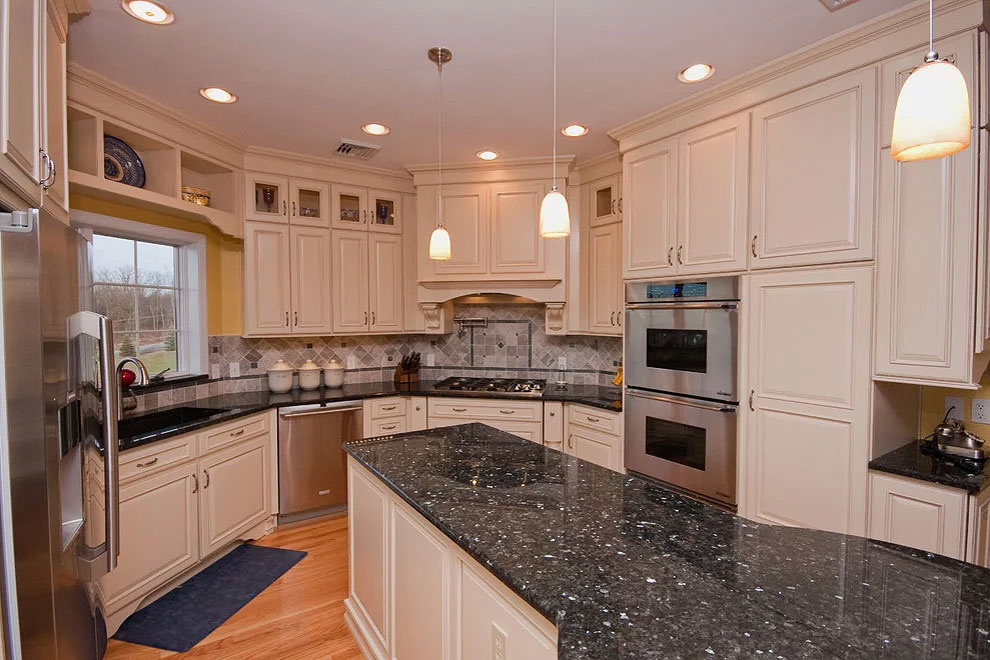 emerald pearl granite white shaker cabinetry