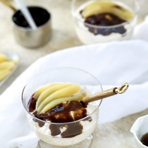 Photograph of Posh Rice Pudding with Salted Caramel Sauce, Poached Pears and Vanilla Syrup