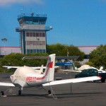 Small aircraft parked near an ATC tower - Follow Up on the FAA Hiring Scandal