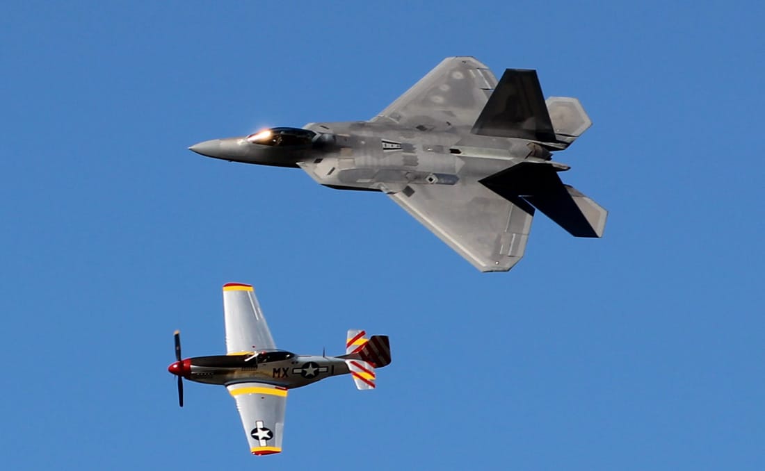 Jet aircraft and piston engine airplane flying together at 2016 Sun n' Fun International Fly-In and Expo