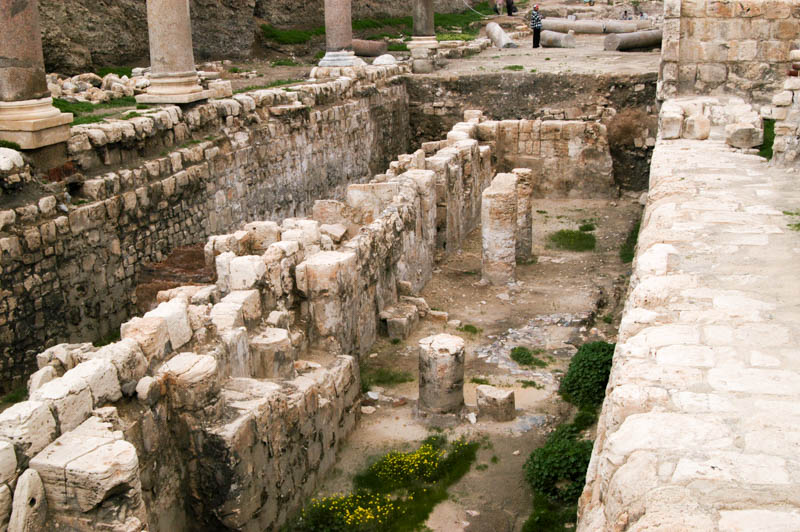 column bases and facades along a narrow alley