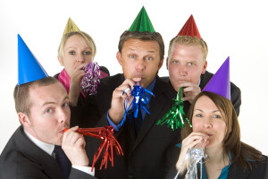 Group Of Business People Wearing Party Favors