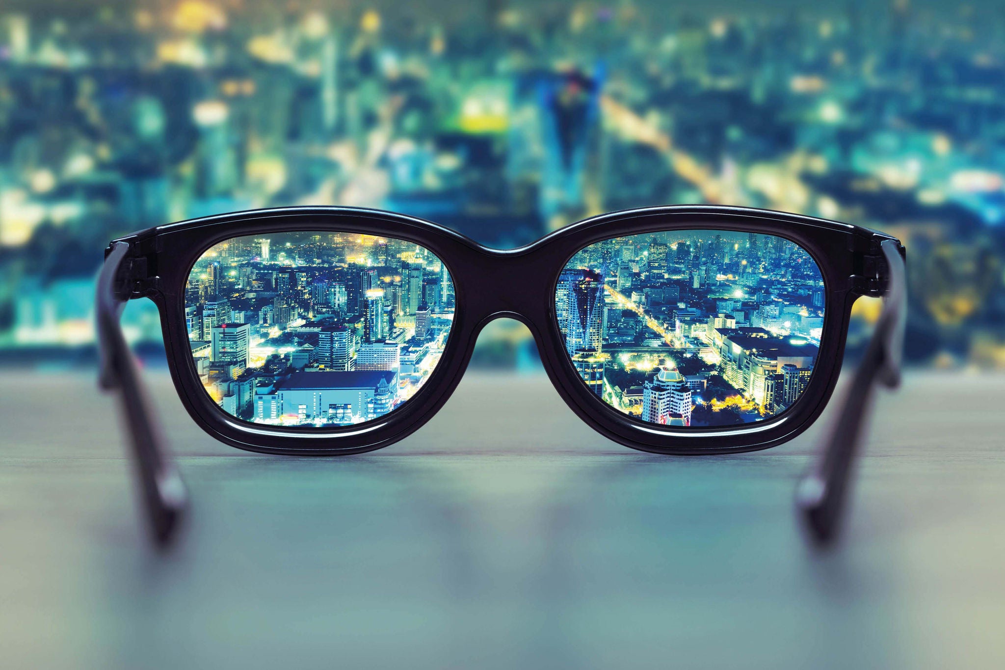 Night cityscape focused in glasses lenses; Shutterstock ID 225924757