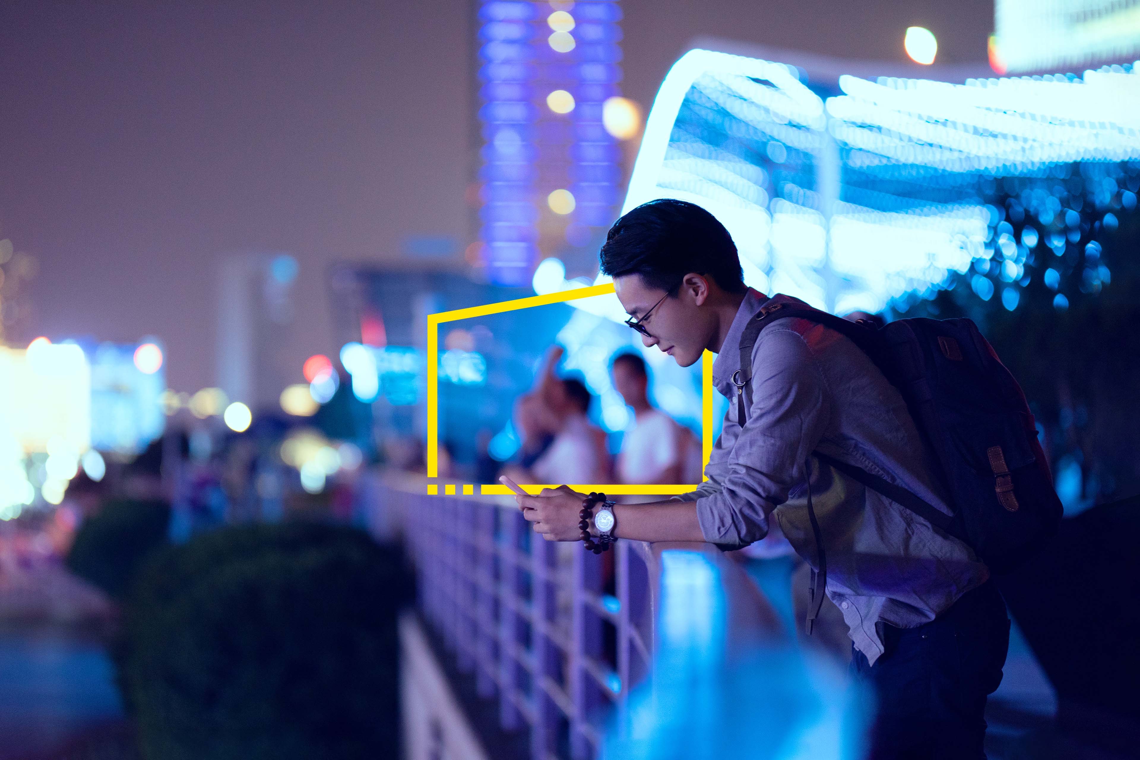 Young businessman looking at smartphone