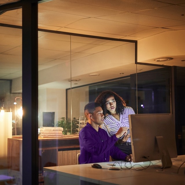 two people looking at computer