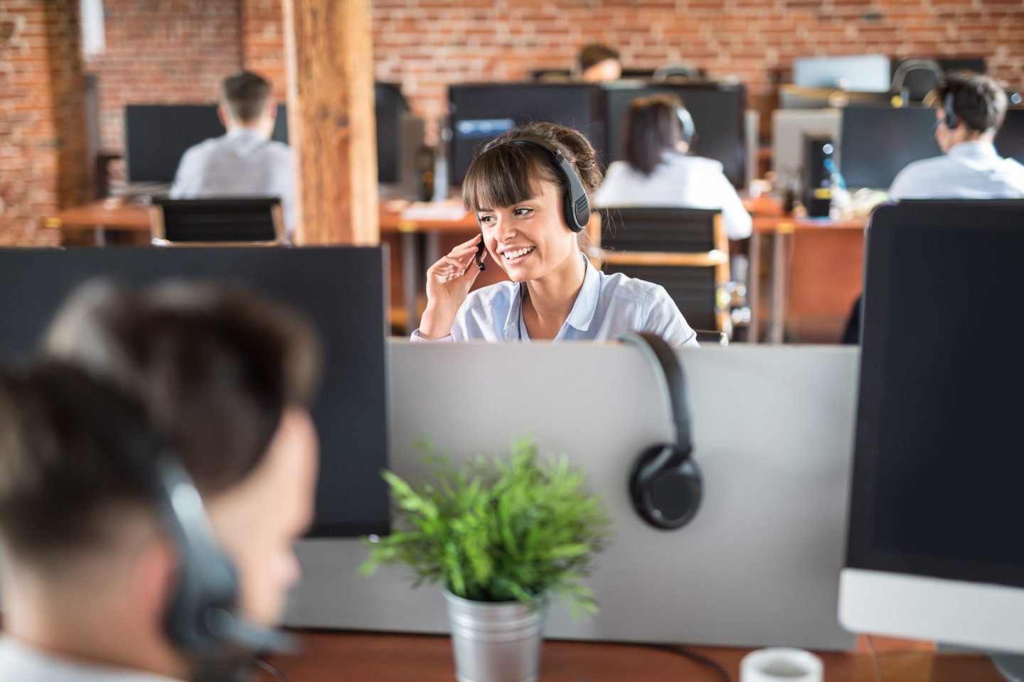 Call center worker accompanied by her team.