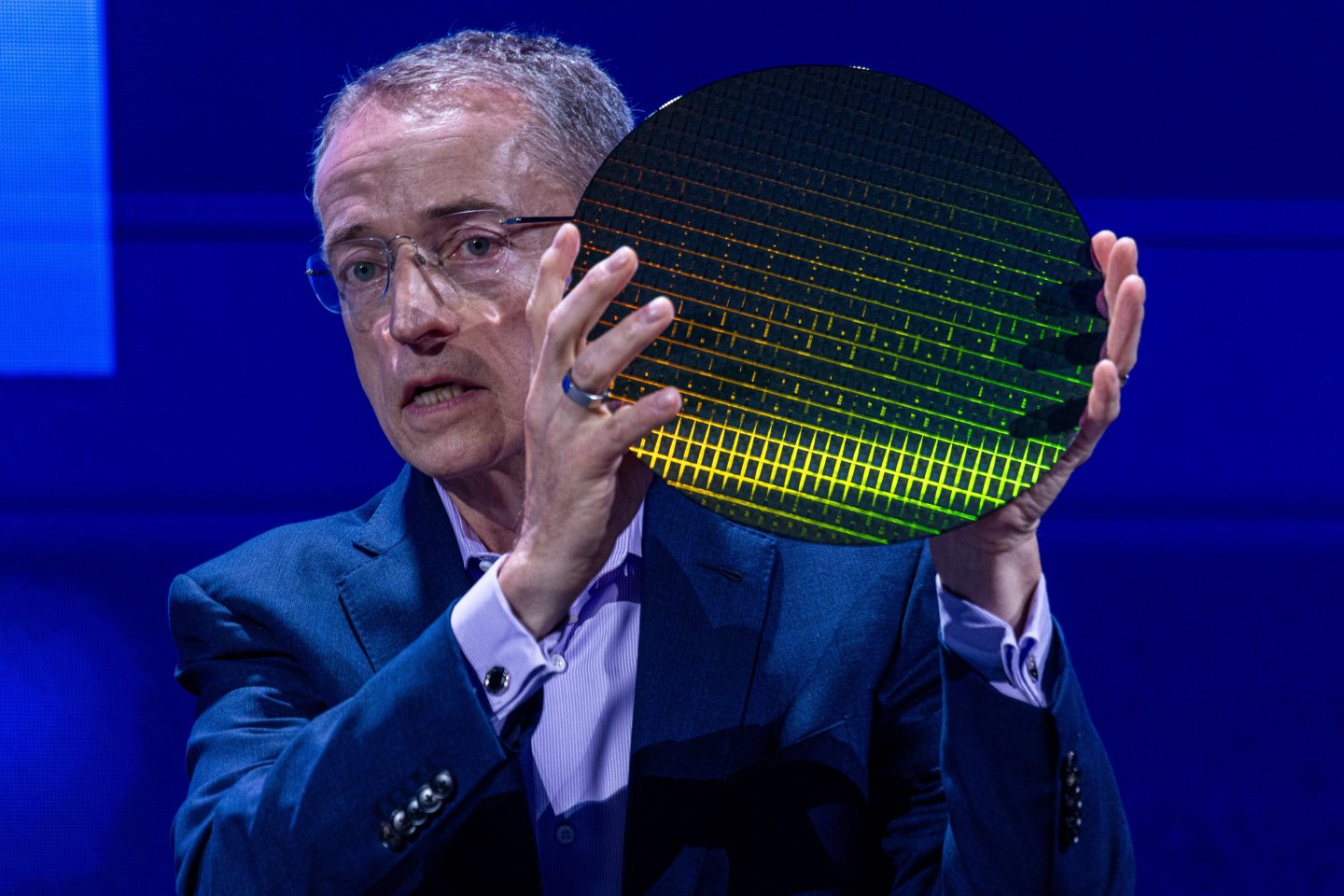 Pat Gelsinger, chief executive officer of Intel Corp., holds a wafer as he speaks at the Computex conference in Taipei, Taiwan, on Tuesday, June 4, 2024.