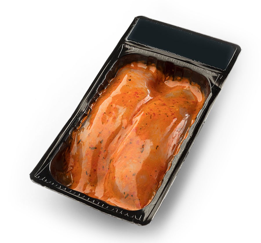 Vacuum-sealed marinated boneless skinless chicken breasts