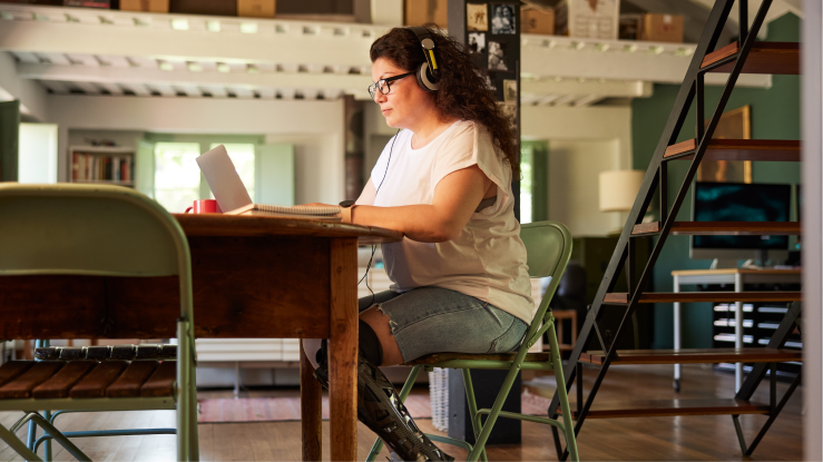 A woman working on her computer.