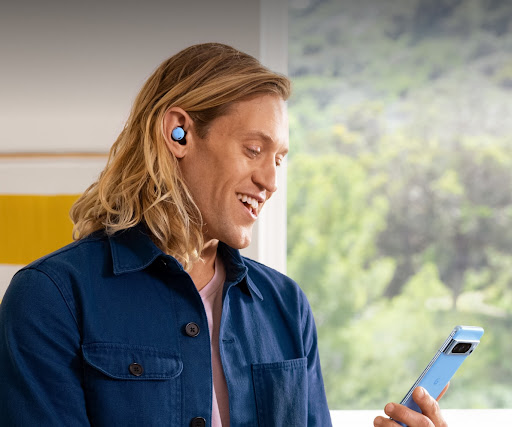 A person taking a phone call using Pixel Buds Pro and Pixel phone in Bay