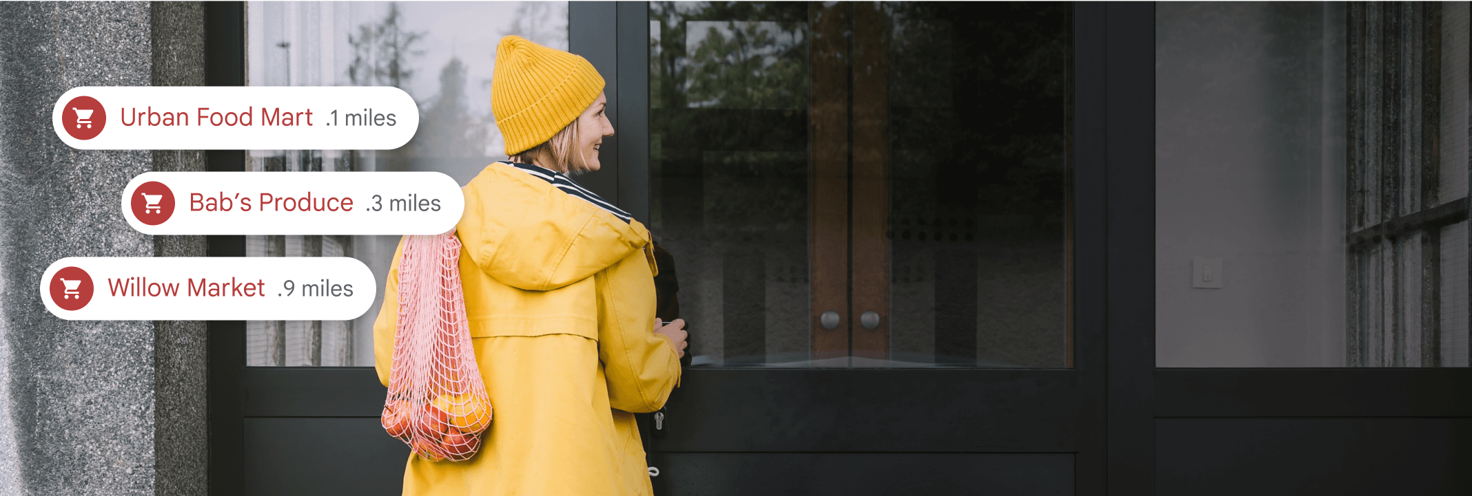 A woman looking at a building with neighborhood information