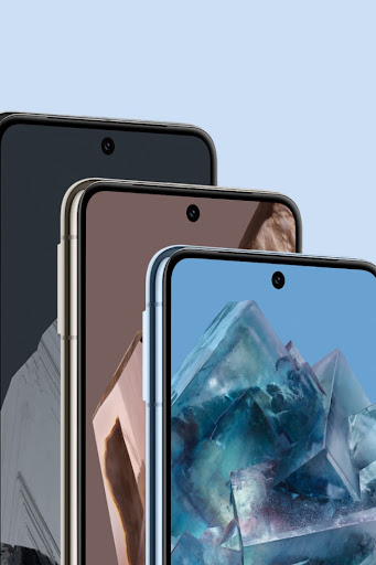 Three Pixel 8 Pros in various colours. They stand behind one another. Their home screens are on, showing off the smooth, scratch-resistant glass.