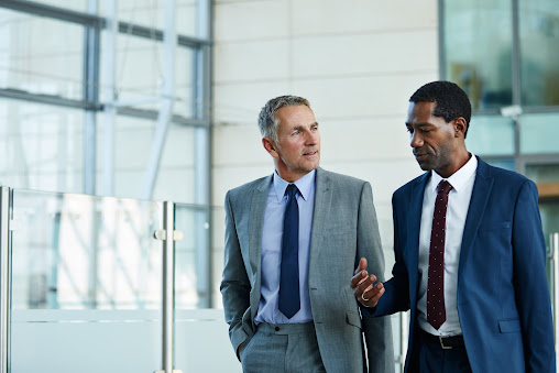 Two men talking. 