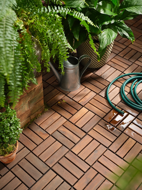 An in/outdoor/galvanised SOCKER watering can outside