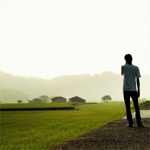 eliot. - man standing next to field ipad wallpaper