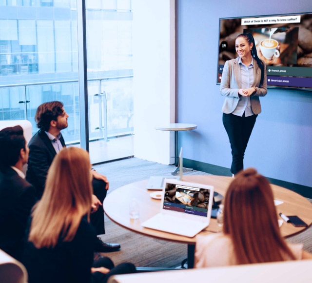 Female presenter presenting a kahoot interactive presentation