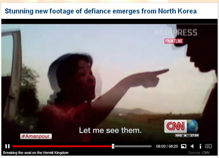 A North Korean woman, an owner of private bus service, standing up to a government soldier who tried to shut down her business on grounds that it's illegal. (Courtesy of CNN)