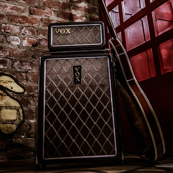 guitar laying on vox amp