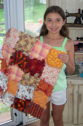 Christina made a raggedy quilt for her doll.