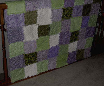 Try making a shabby chic cottage style raggedy quilt with lilac and green fabrics.