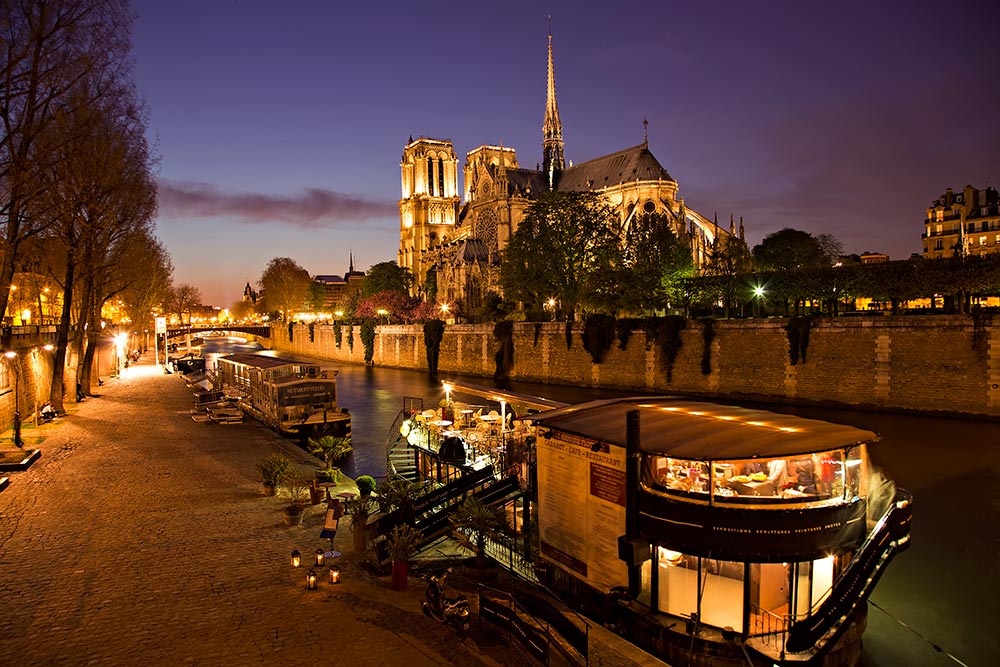 notre-dame-cathedral-night-seine-paris-france-featured