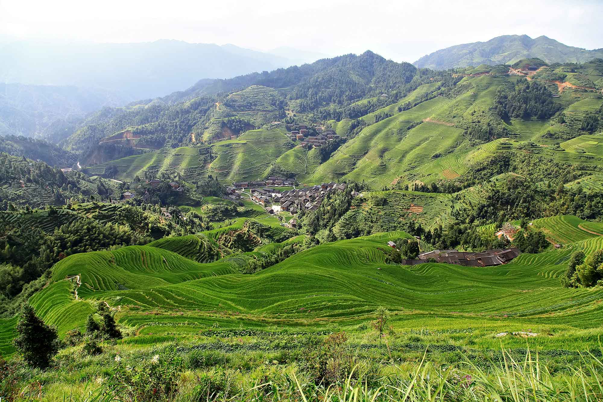 walking-along-longji-rice-terraces-dazhai-guangxi-china-2