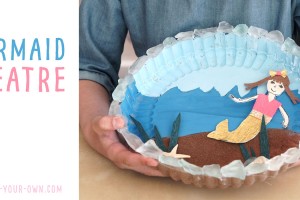 Make a RECYCLED MERMAID THEATRE: Use your beach treasures and a plastic lid to create this stick puppet theatre for imaginative play!