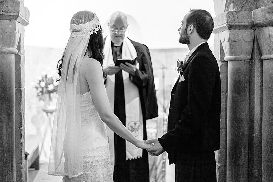 Bride and groom during the wedding ceremony at Edinburgh Castle