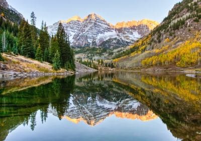 Calm lake with mountains in the background