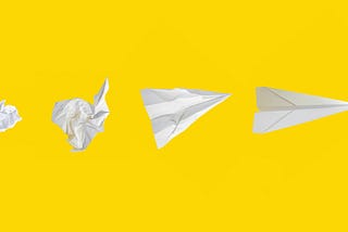 Ball of paper turning into a paper airplane on yellow background.