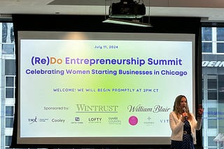 Gale Wilkinson kicks off the (Re)Do Entrepreneurship Summit on stage.