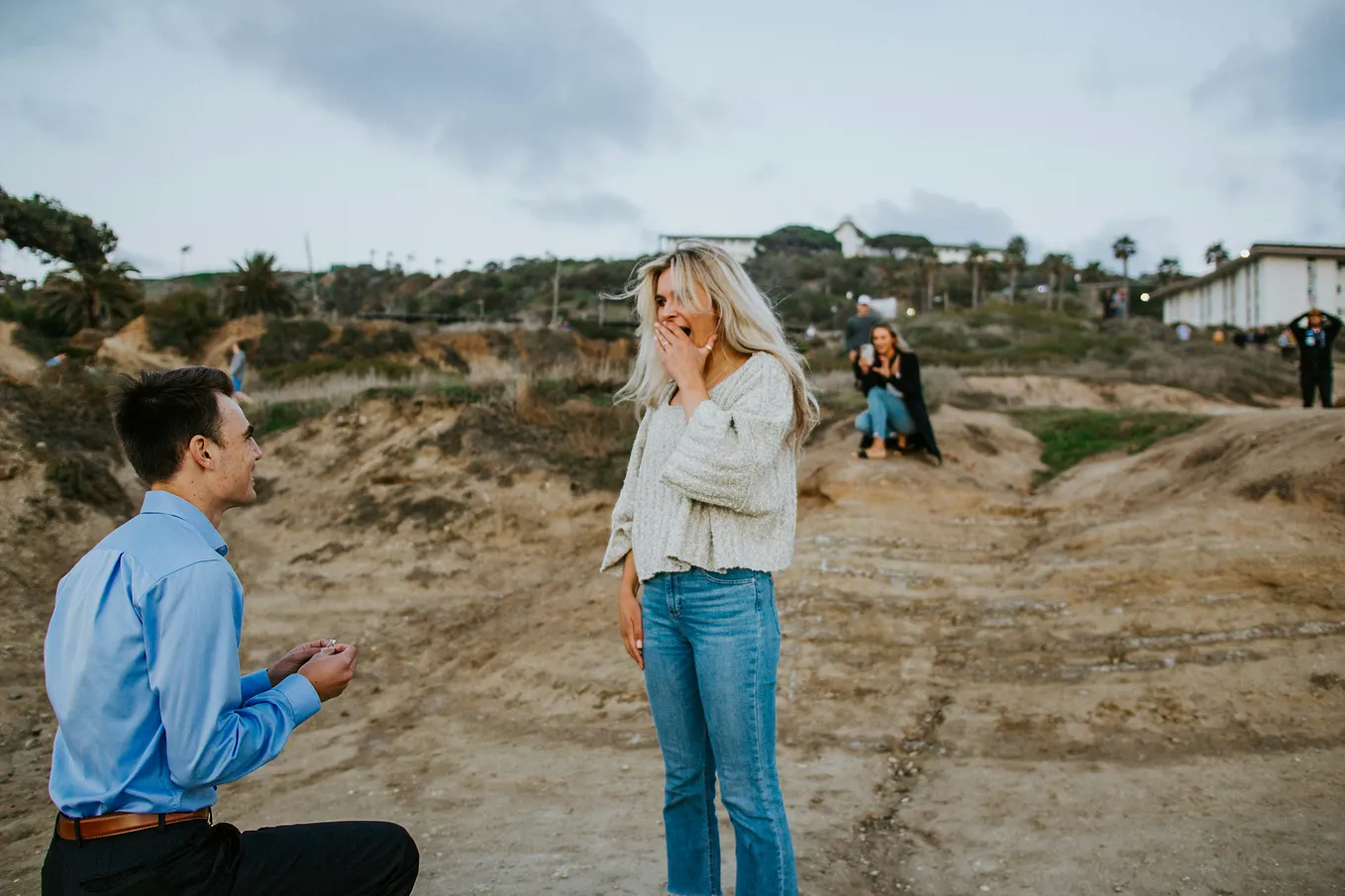 A man proposes marriage to a woman