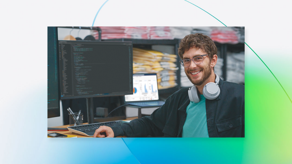 a man standing in front of a computer