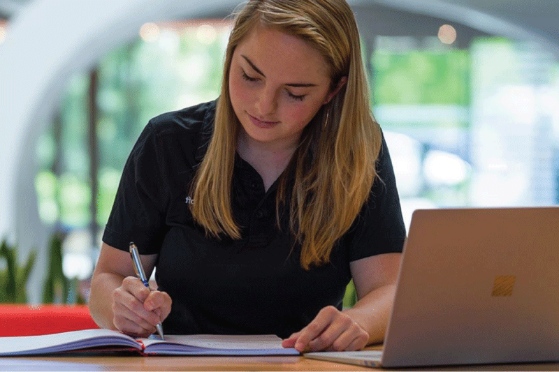 Photo of woman working with laptop