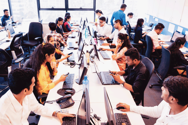 Photo of students working on laptops in computer lab